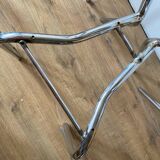 4 chrome chairs with green and white checkered tiles