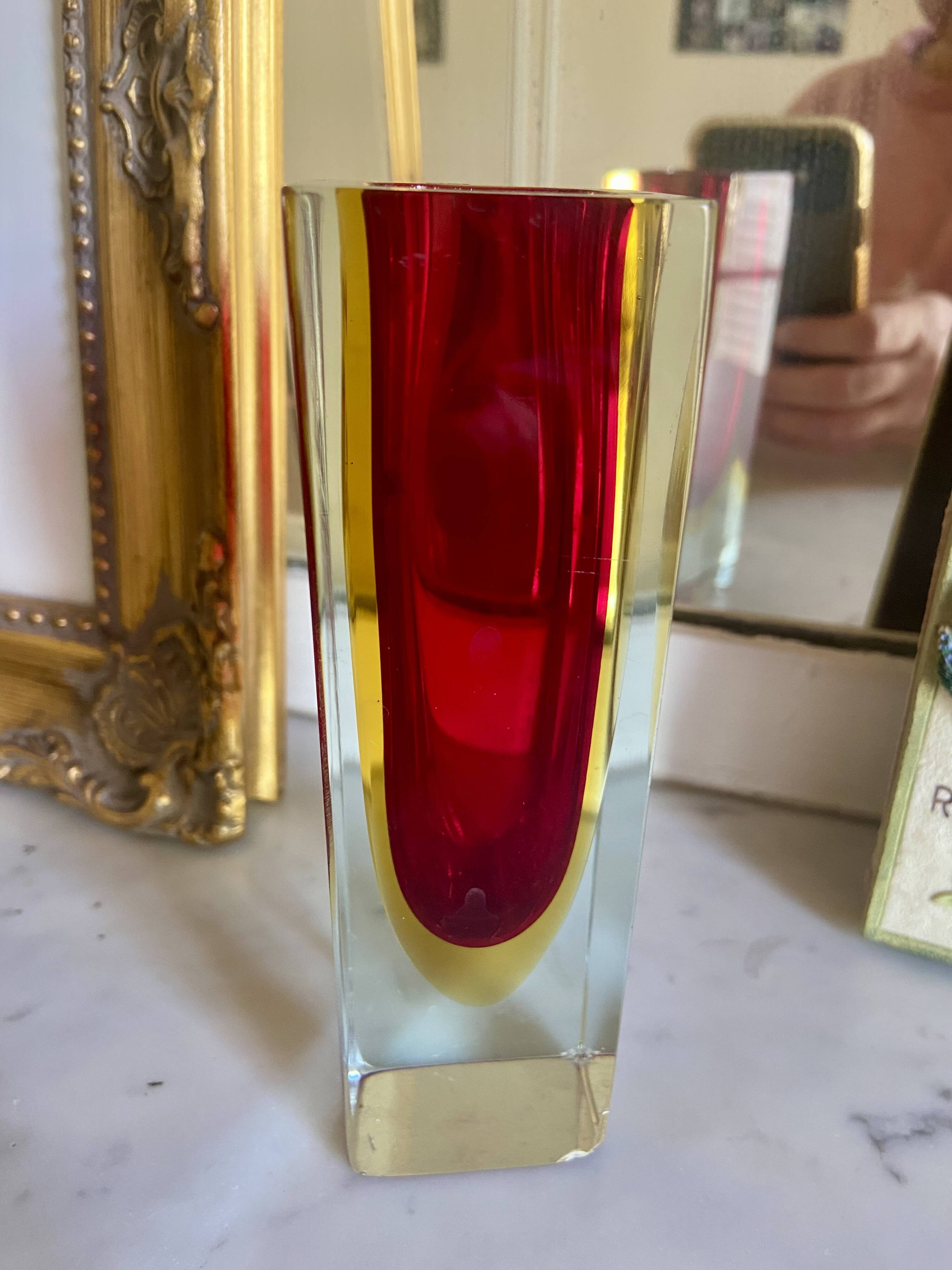 Small red vase made of Murano glass.