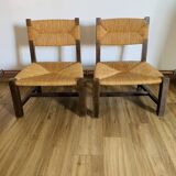 Pair of low wooden and straw armchairs