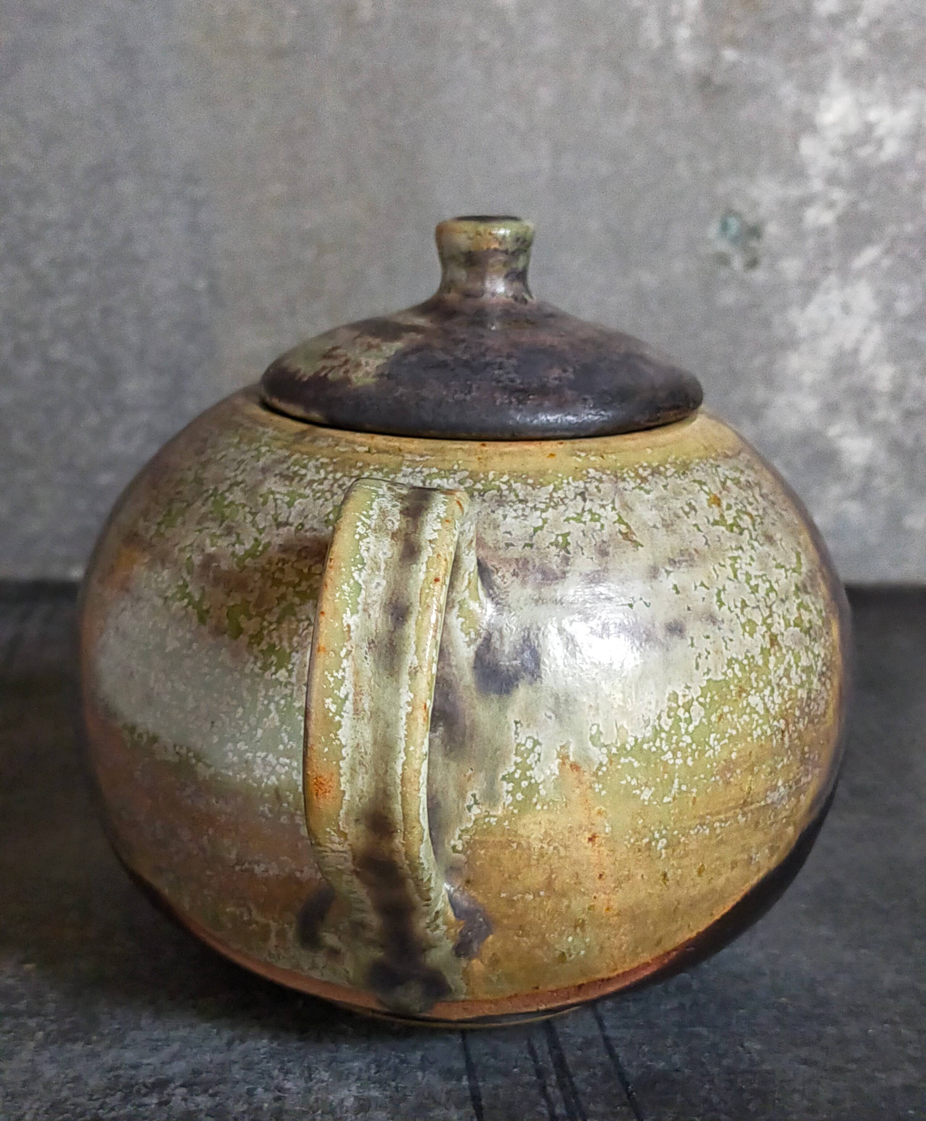 Vintage enameled stoneware potter's teapot