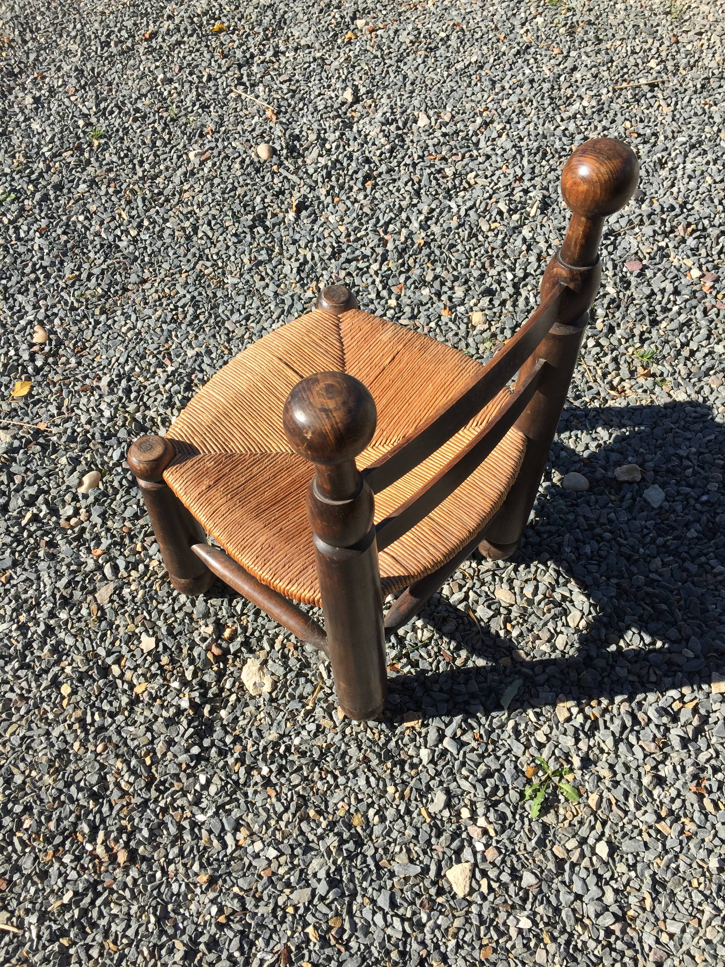 Straw low chair in the style of Charles Dudouyt