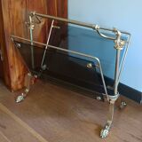 porte revues en bronze et verre teinté 1950 à pieds griffés