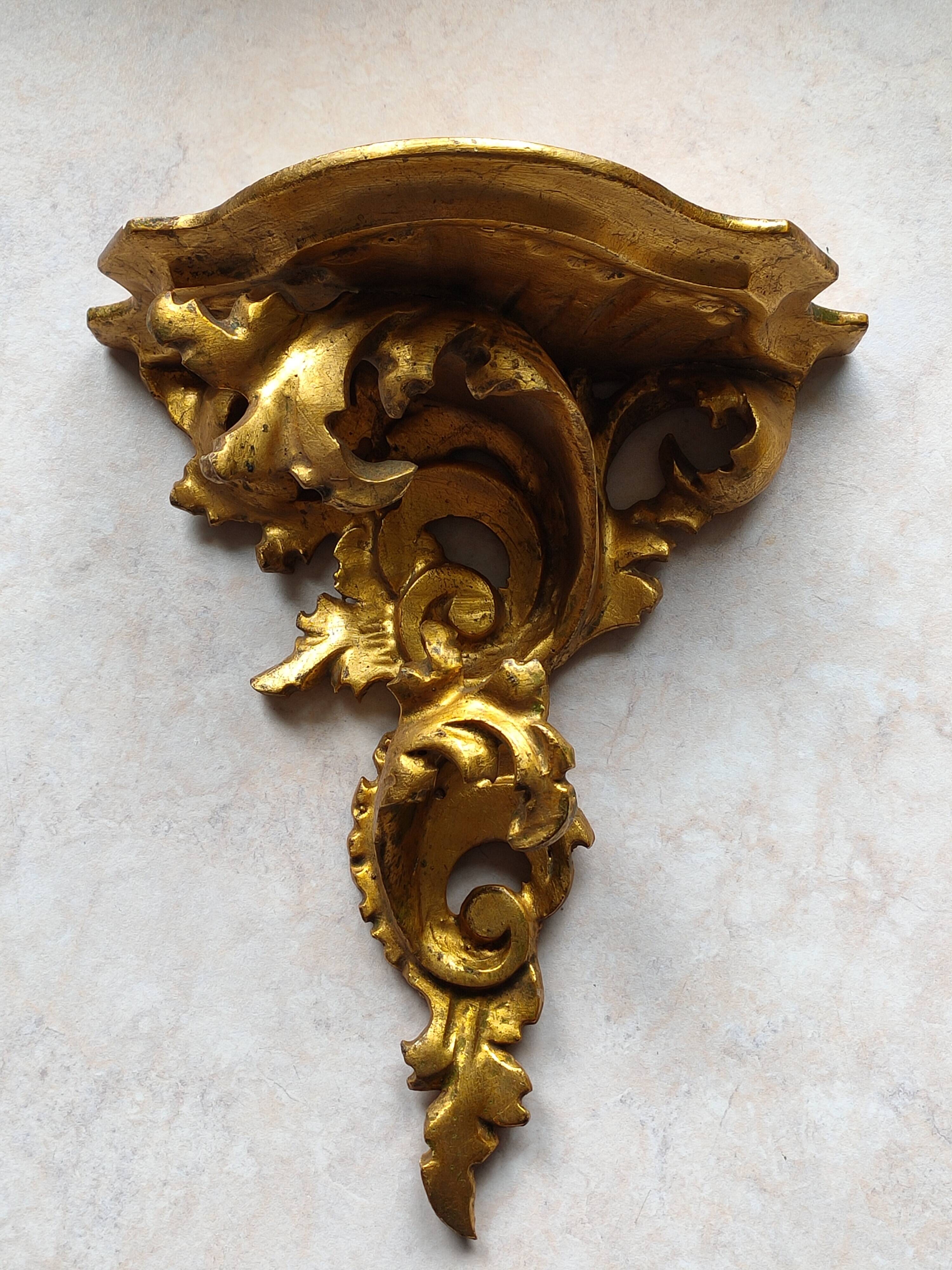 Baroque style golden shelf.
