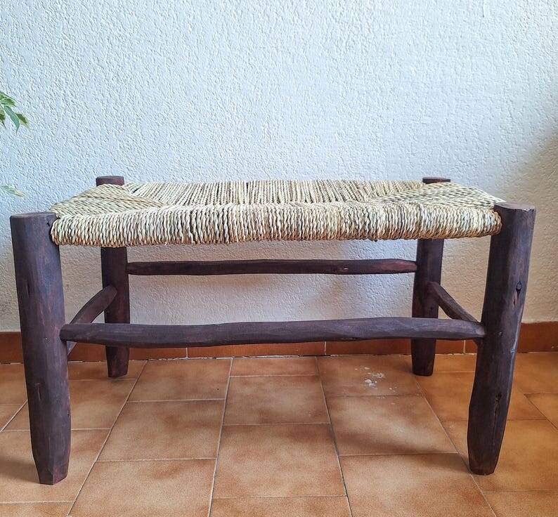 Moroccan bench in dark wood with woven palm leaf seat