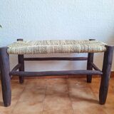 Moroccan bench in dark wood with woven palm leaf seat