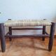 Moroccan bench in dark wood with woven palm leaf seat