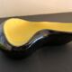 Yellow and black ceramic ashtray