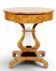 An Empire round side table made of beech wood and elm burl with 1 drawer.