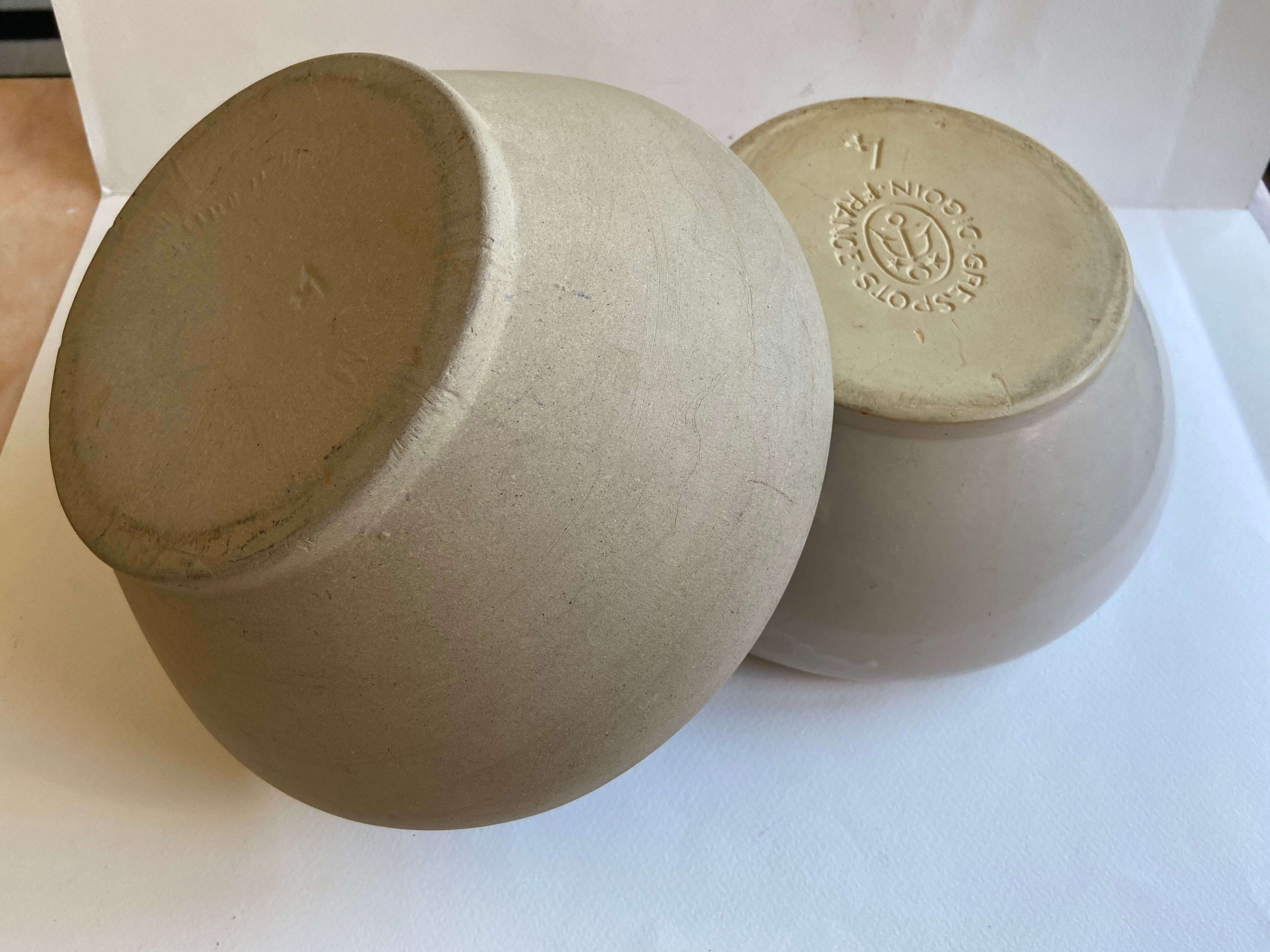 Pair of enamelled sandstone bowls