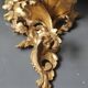 Small Italian/Baroque wall-mounted console. In gilded wood.