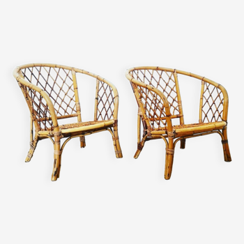 Pair of rounded rattan armchairs