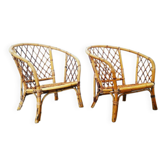 Pair of rounded rattan armchairs