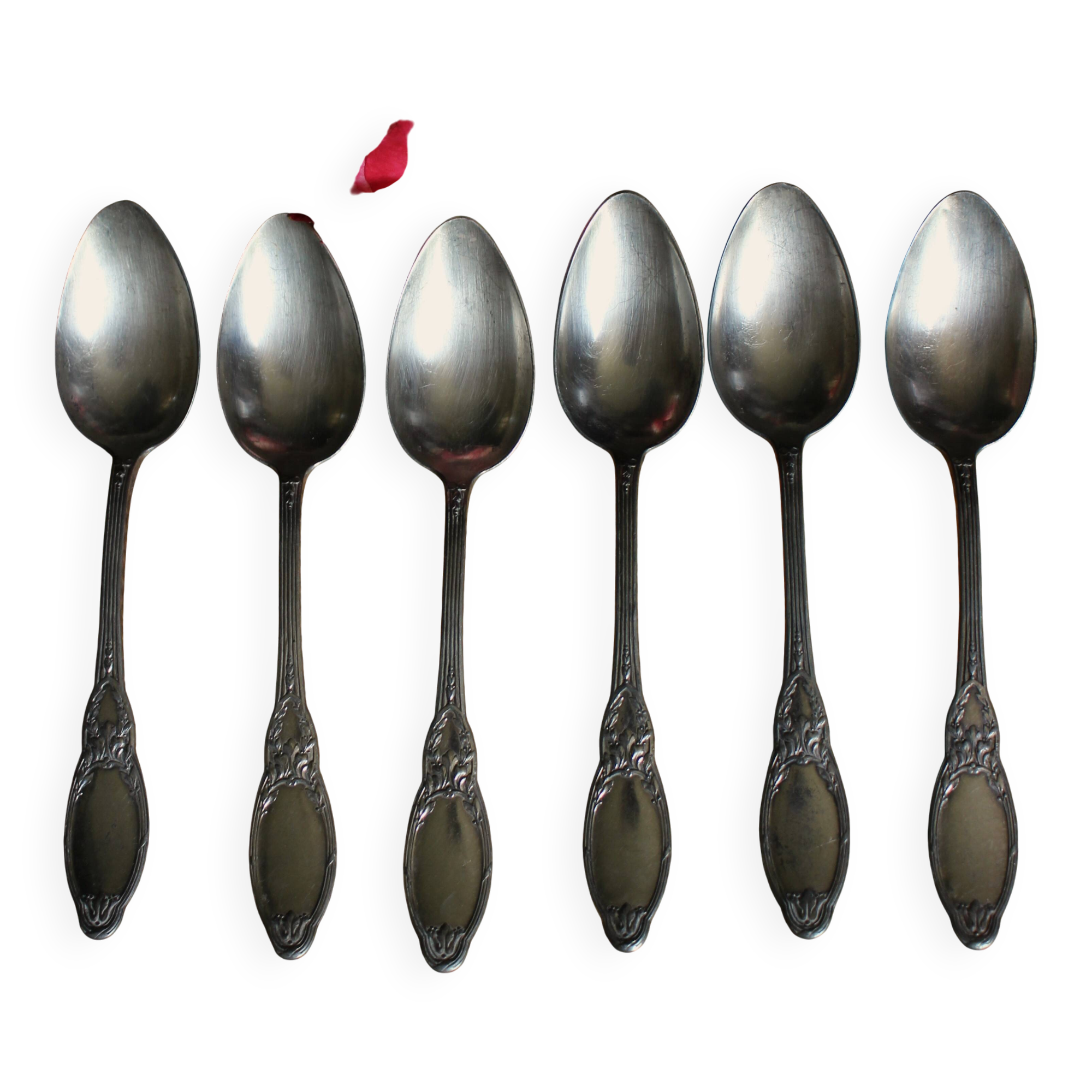 One of 6 silver-plated leafy metal soup spoons