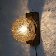 1960s ball wall light in dark wood and amber glass