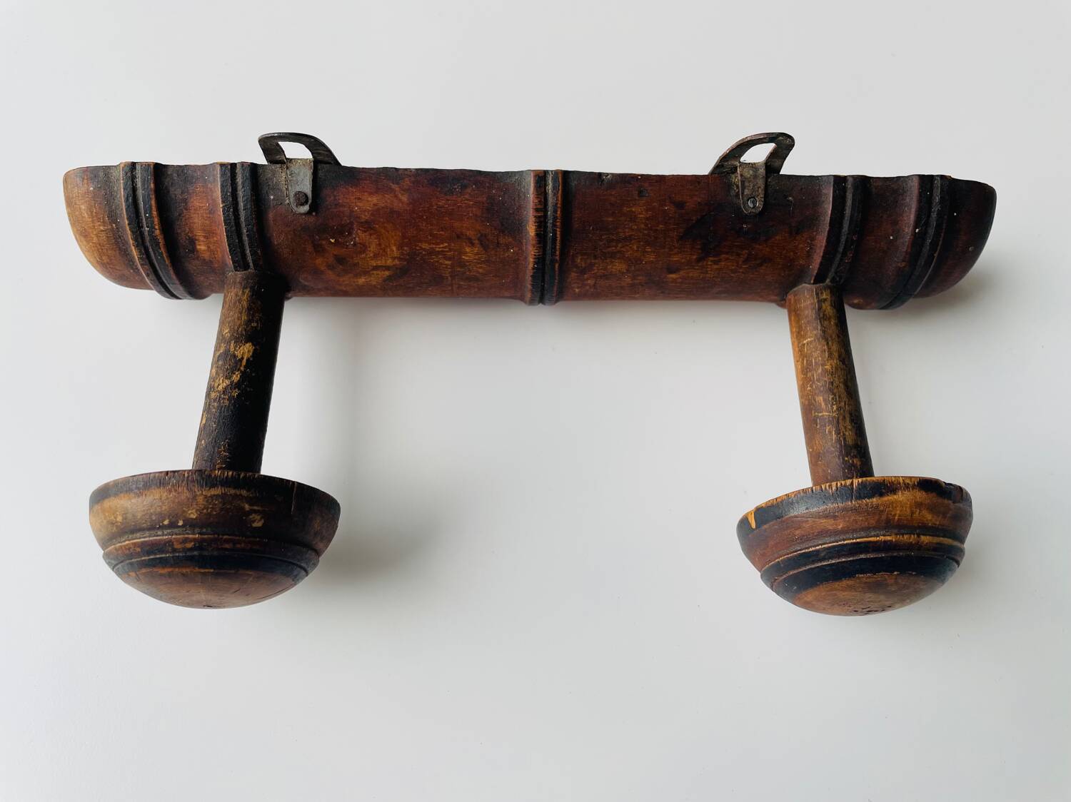 Wooden wall-mounted coat rack with two hooks