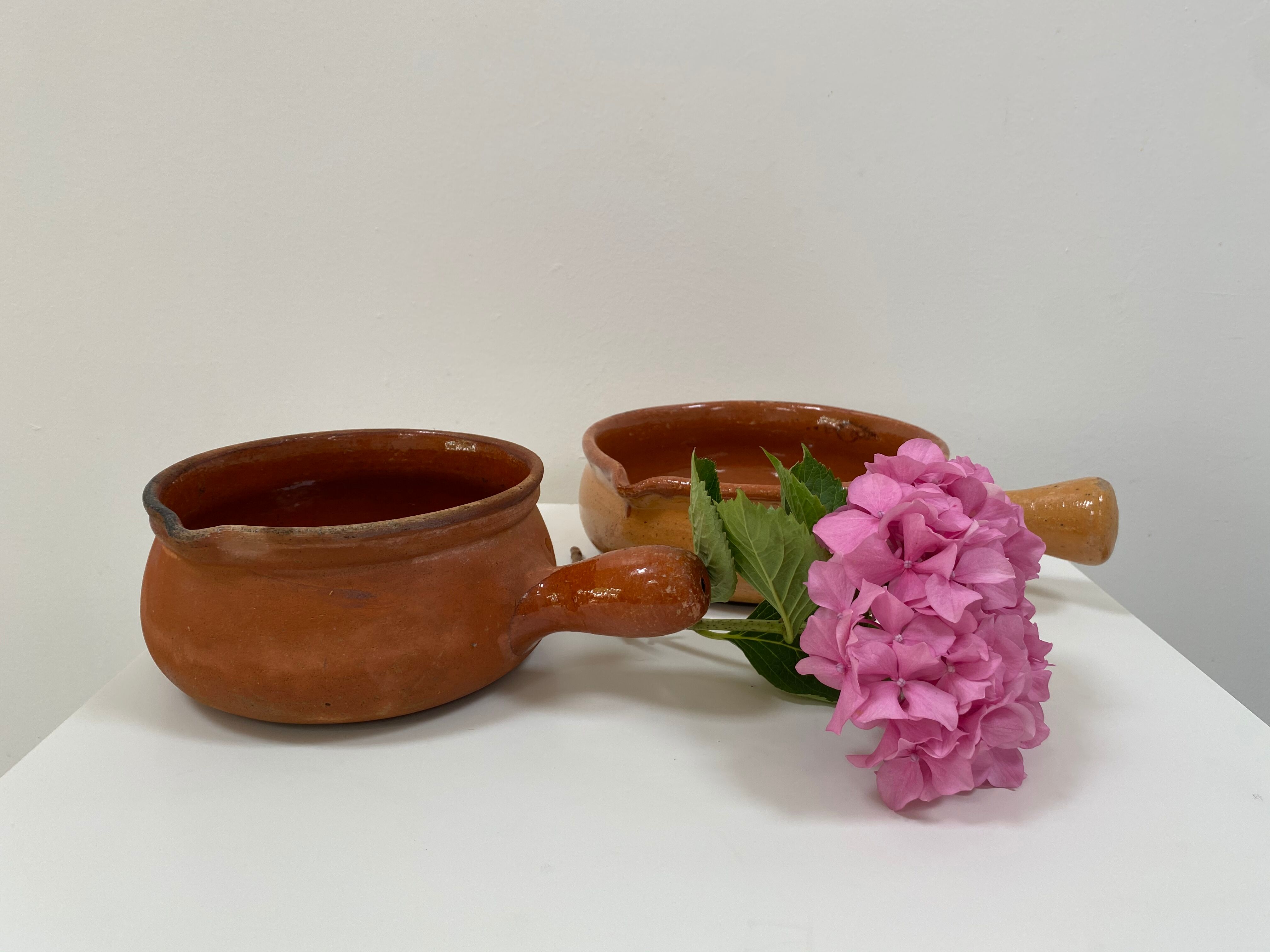 Pair of old pocket pots in glazed stoneware