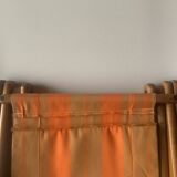 Old foldable beach seat in wood and canvas for children