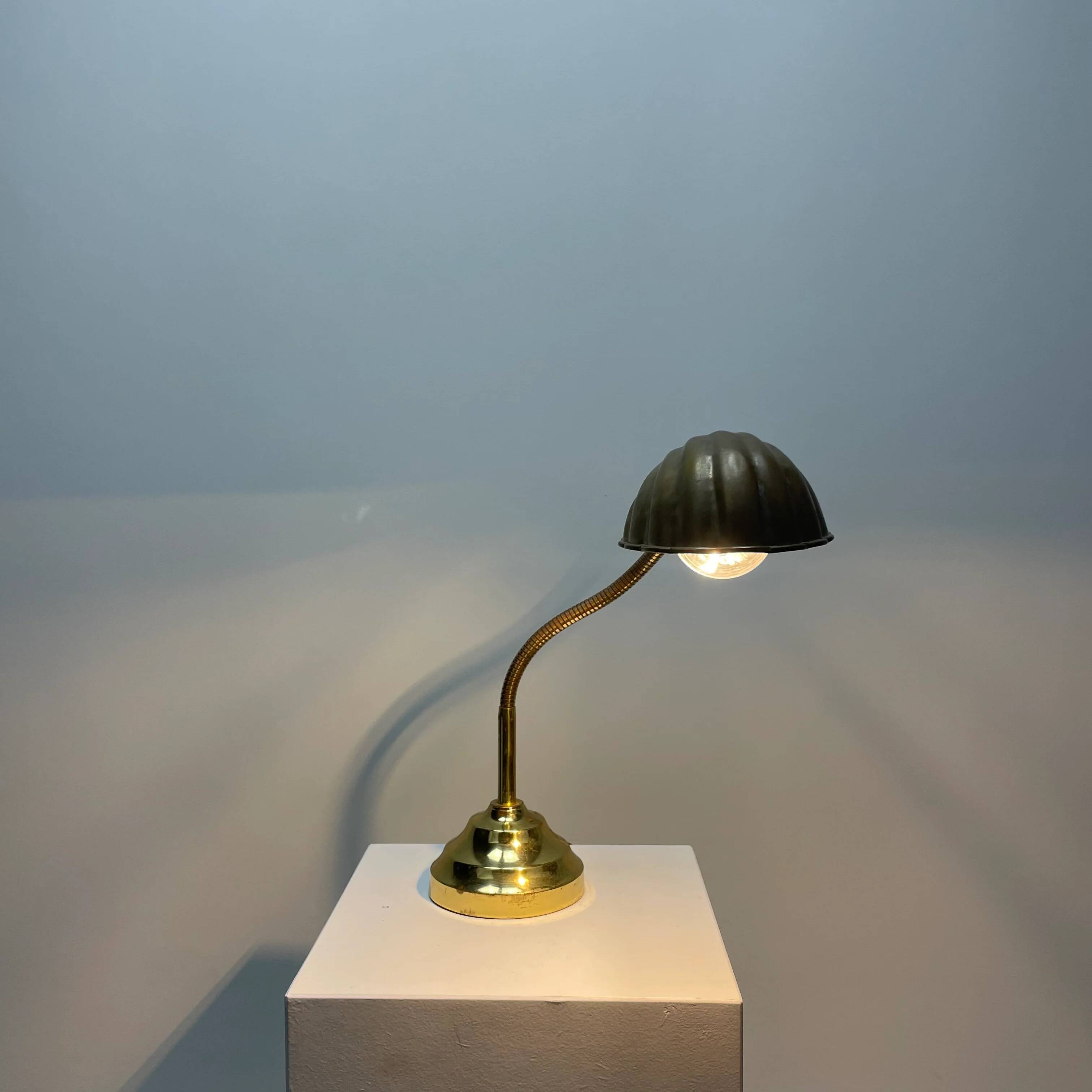 French table lamp in brass with a shell-shaped shade from the 1950s.