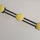 Black and yellow metal wall coat rack (3 hooks)