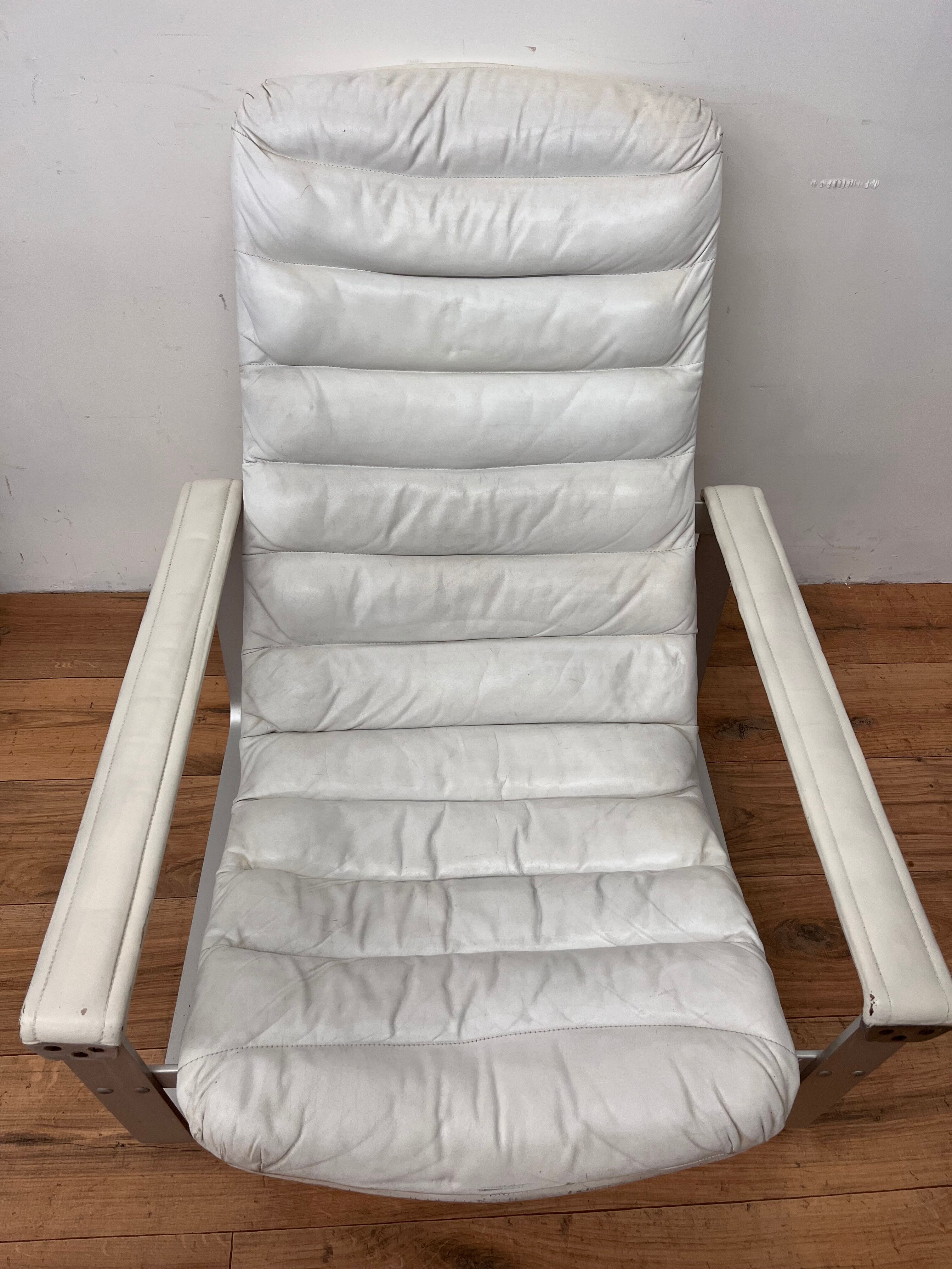 Pulkka armchair by Ilmaria Lappalainen and its ottoman