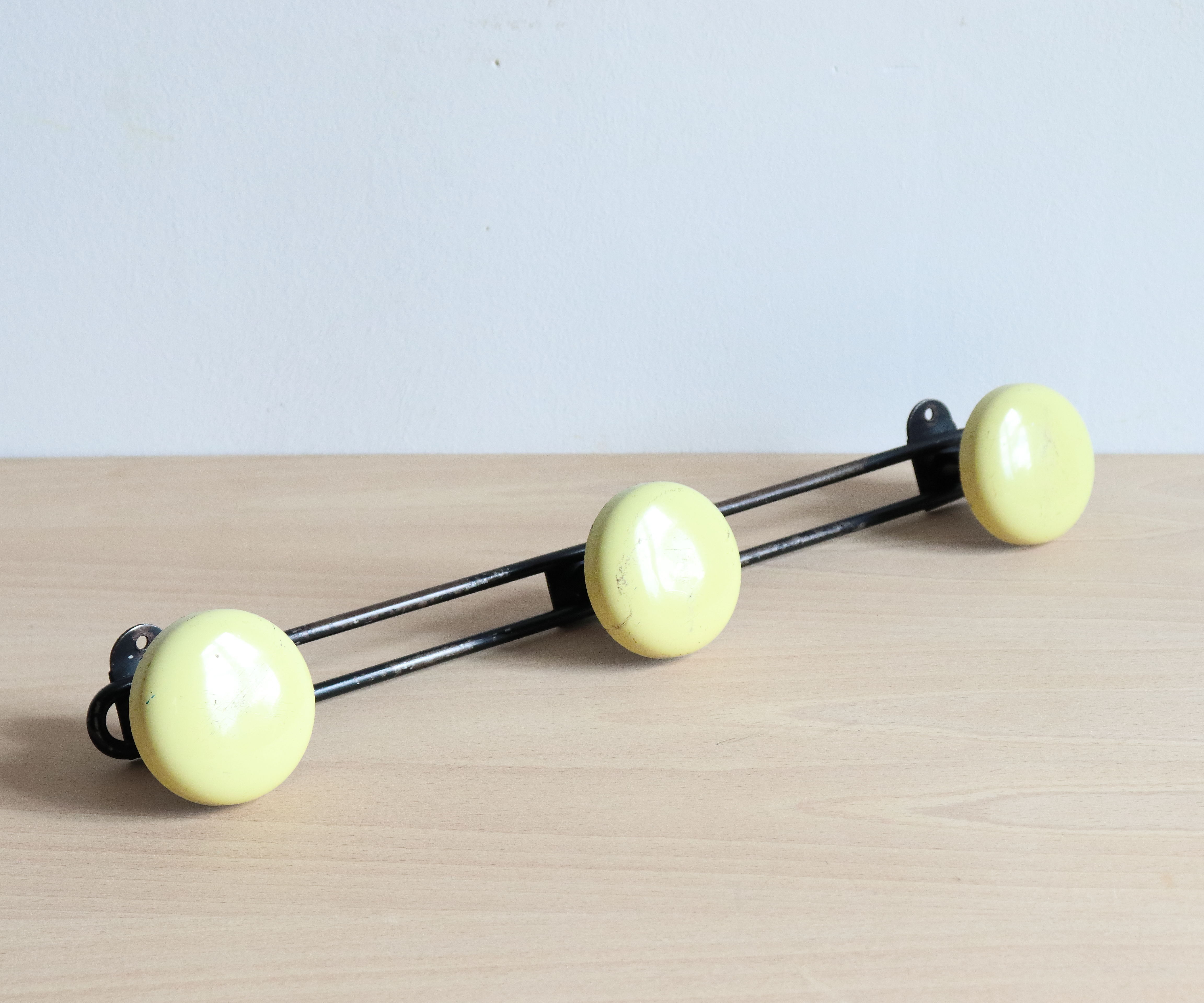Wall doorpiece three black metal and yellow sheet metal