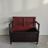 Natural wood chest forming a bench, ringed shoulders