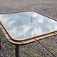 Table with an old ship porthole in brass and a metal base / 100 x 85 x 76 cm