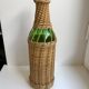 bouteille entourée de rotin années 70