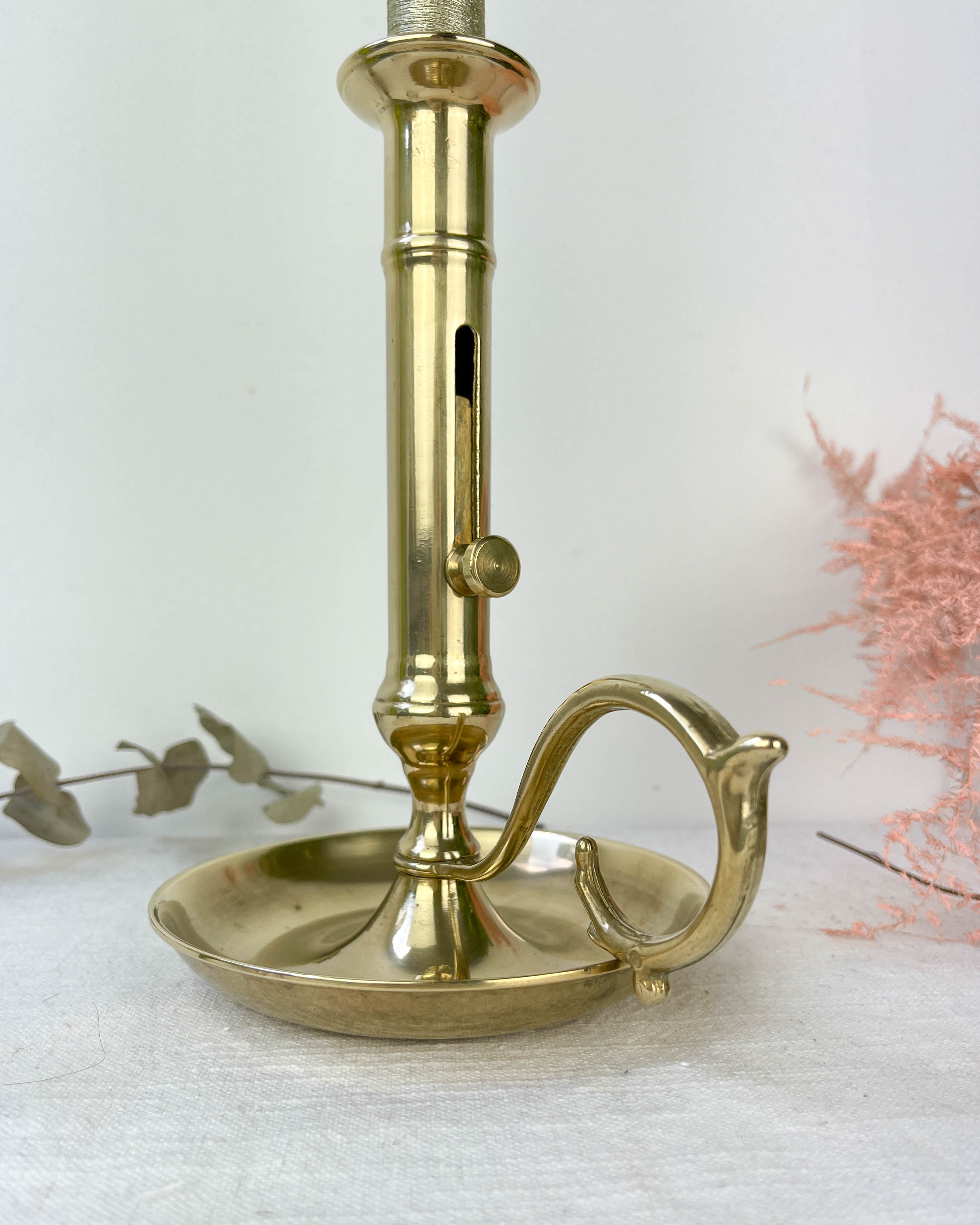 Brass candle holder with pusher late nineteenth century