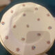 Dessert plate and porcelain dishes with a multicoloured floral pattern, vintage.