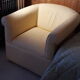 Club armchair in yellow and white striped fabric