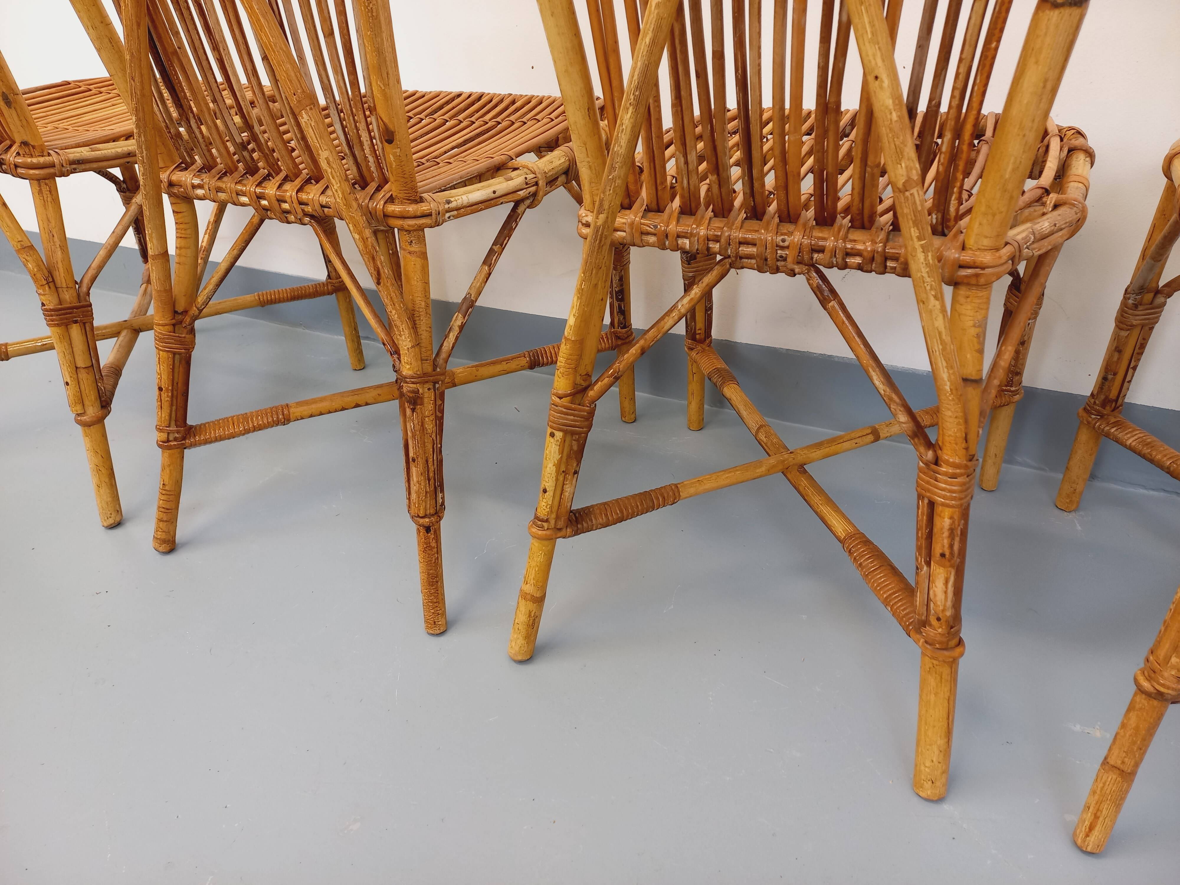 Set of 4 vintage Audoux Minet rattan chairs from the 1950s and 60s.