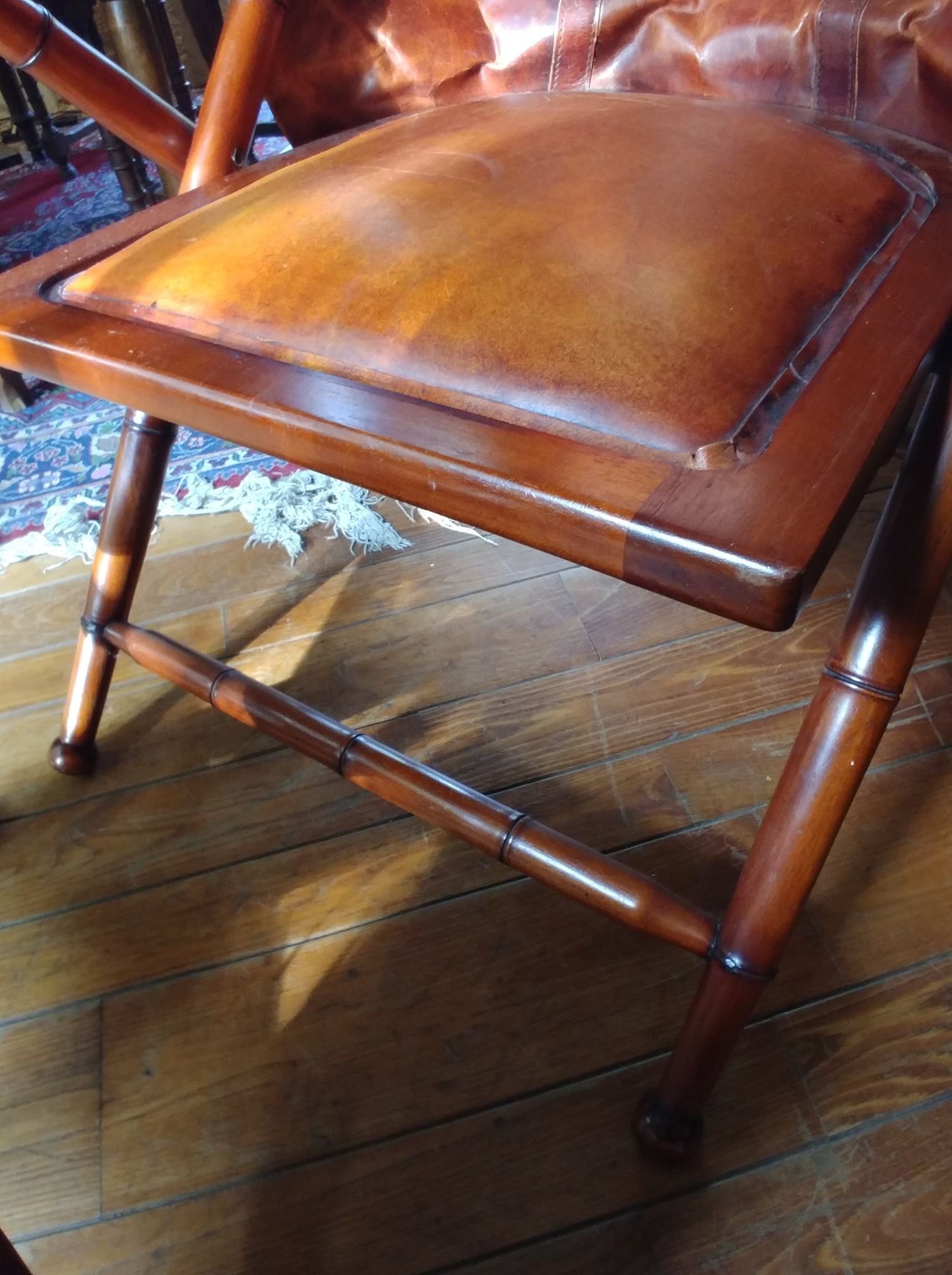 Leather folding armchair and footwork
