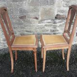 Pair of old chairs with brass elements