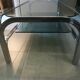 Table basse en métal chromé et verre fumé