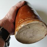 Old bottle in varnished ground.
