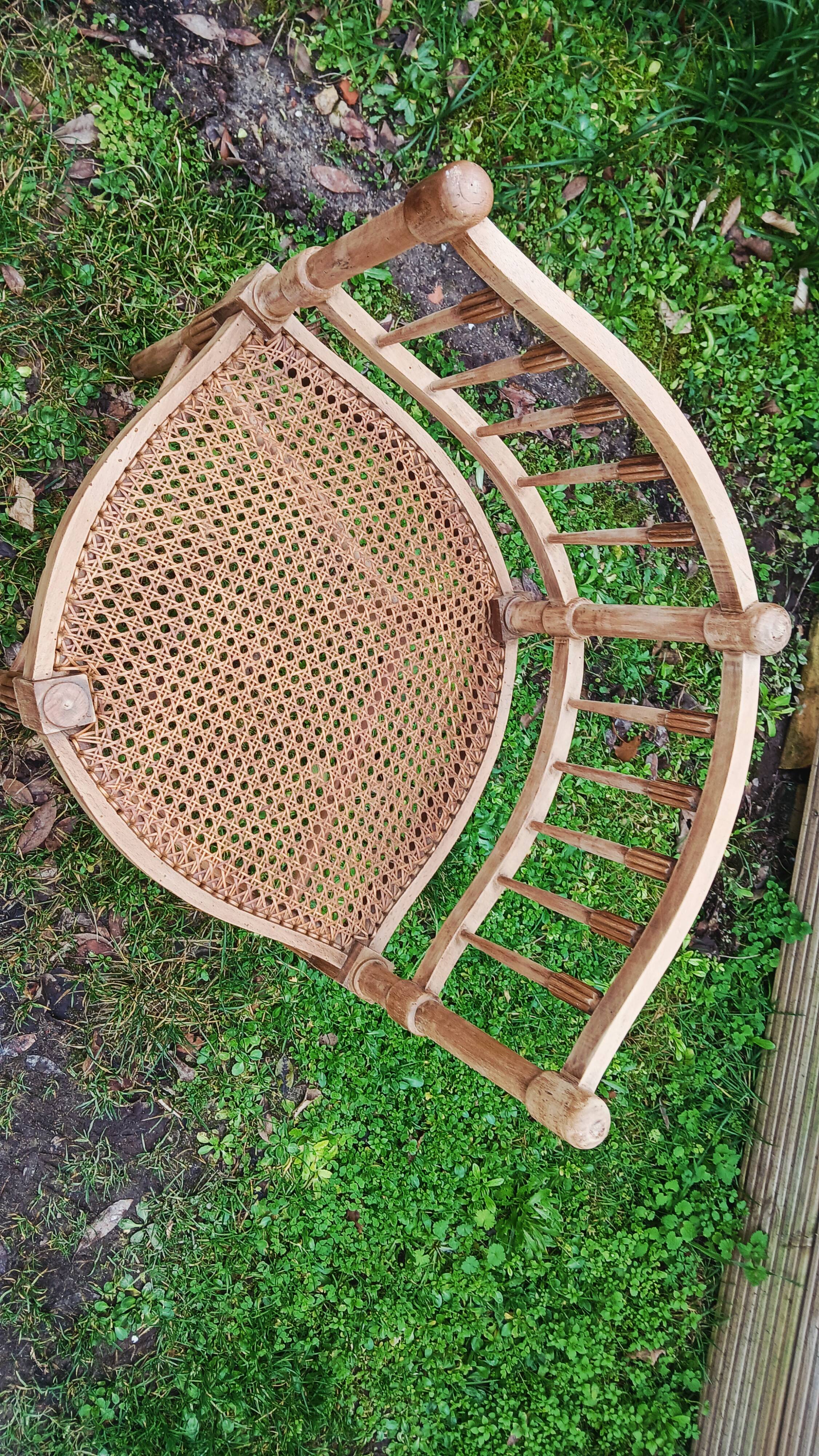 Corner chair in beech, caned seat from the early 20th century.
