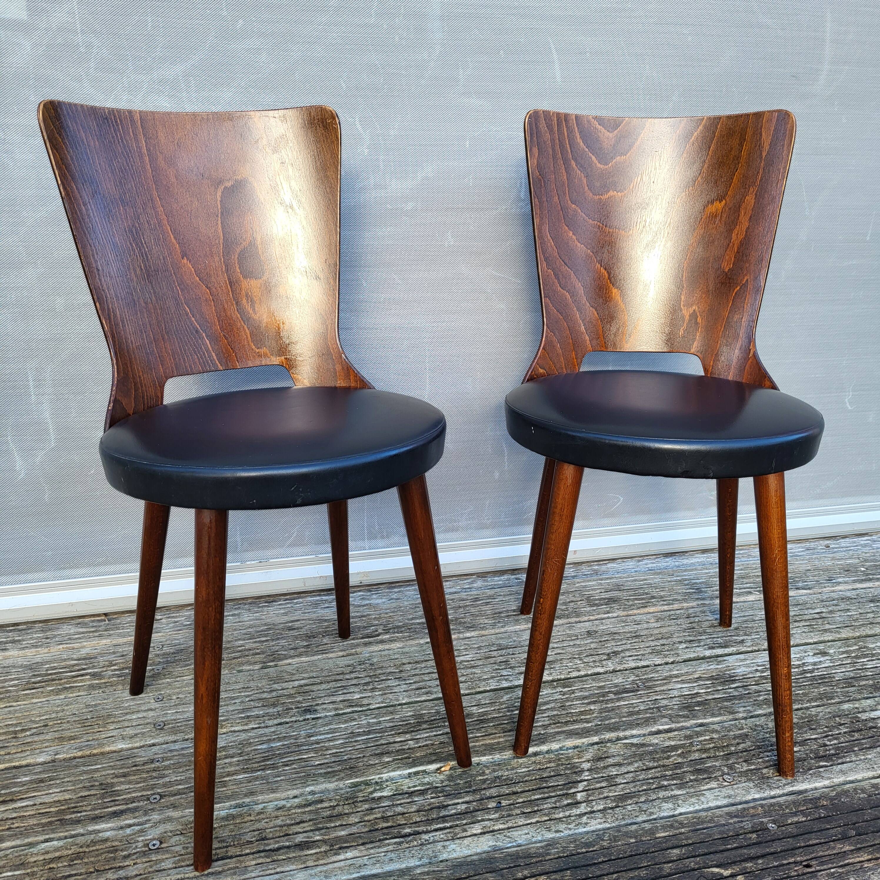 Pair of Dove chairs • Baumann • Black faux leather