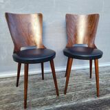 Pair of Dove chairs • Baumann • Black faux leather