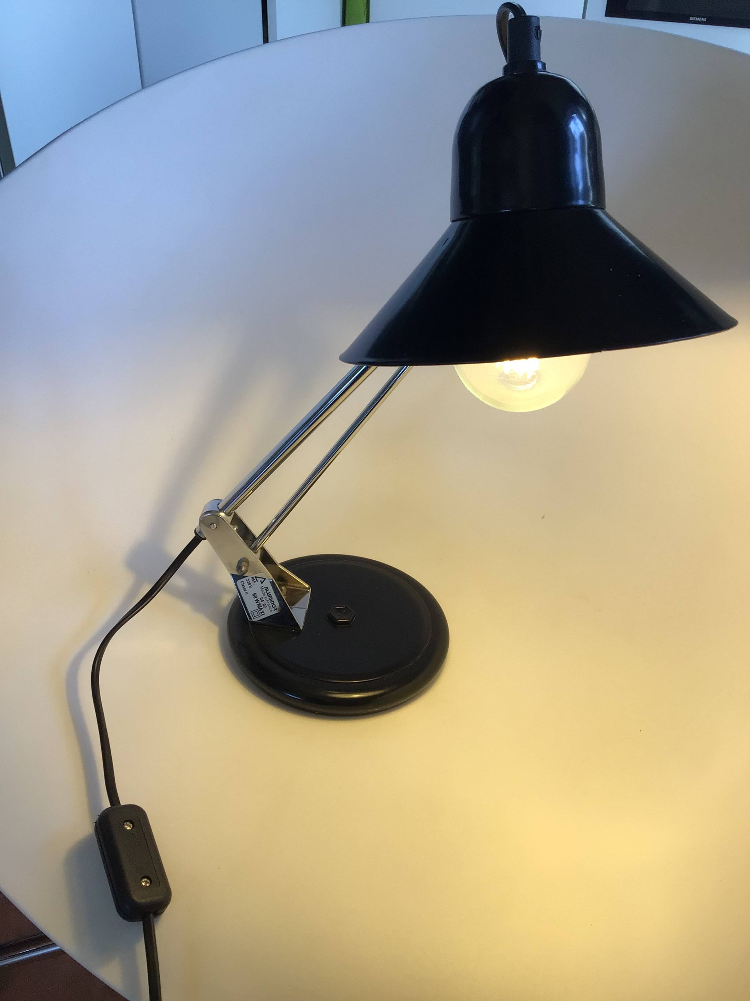Adjustable black metal Aluminor desk lamp