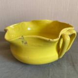 Yellow glazed terracotta salad bowl
