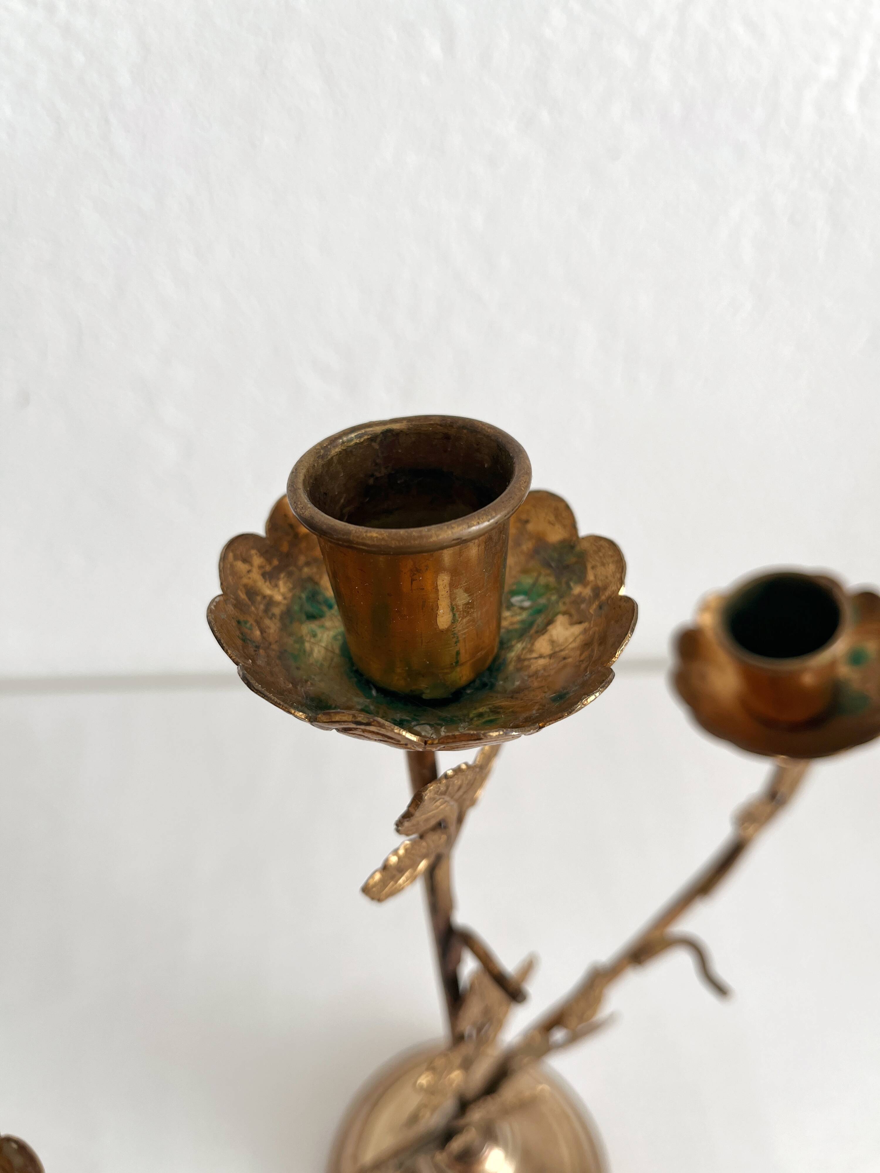 Antique bronze and brass candlestick with golden leaves
