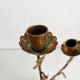 Antique bronze and brass candlestick with golden leaves