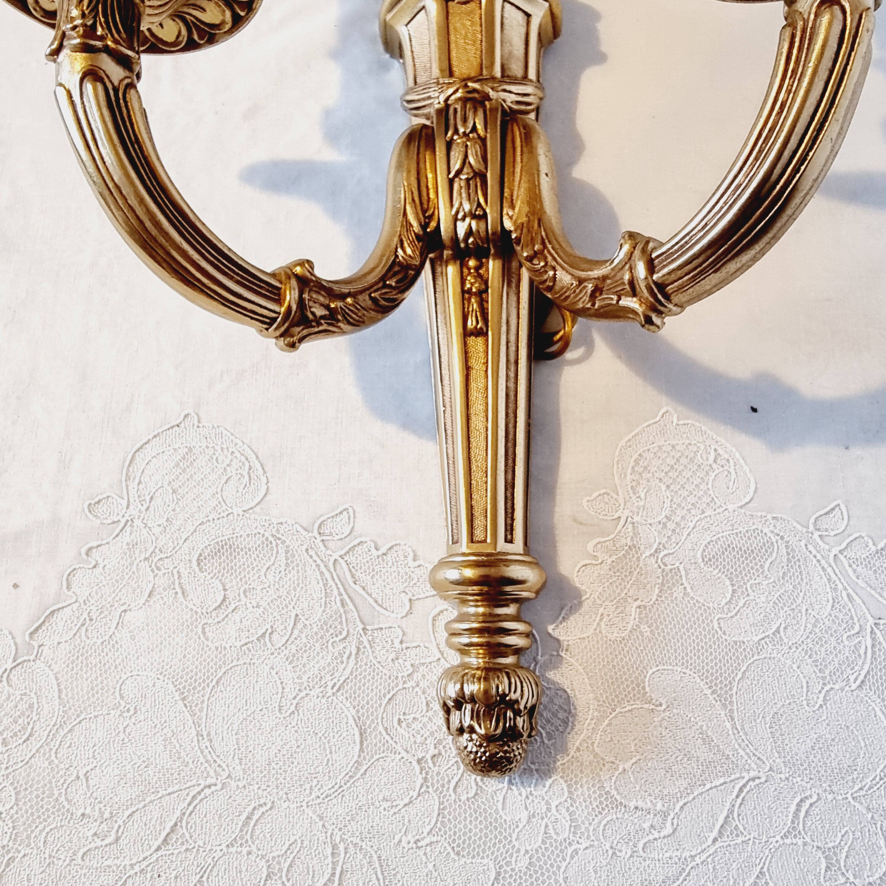 Pair of Louis XV style rocaille two-armed sconces in gilded bronze