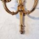 Pair of Louis XV style rocaille two-armed sconces in gilded bronze