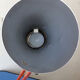 Luxo L9 orange single-arm lamp on plinth