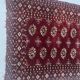 Antique wool rugs with designs on a red background, 20th century.