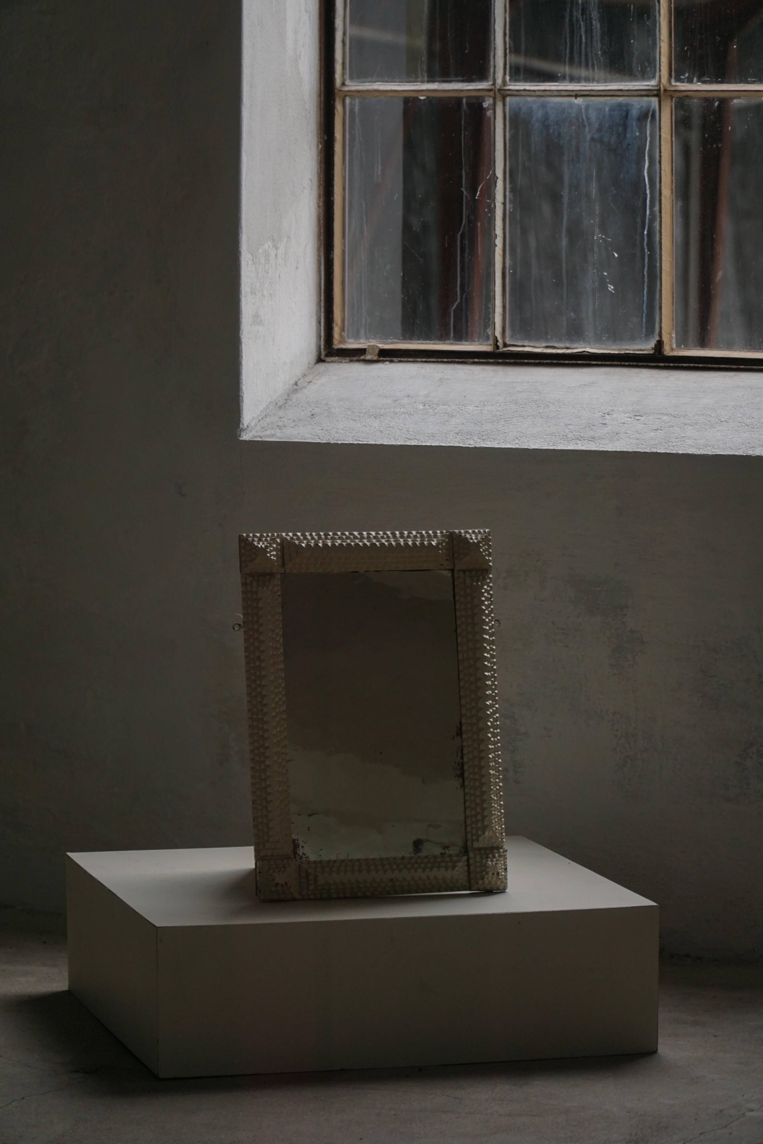 Wall mirror in tramp art style, hand-carved with a painted white frame, early 1900s.