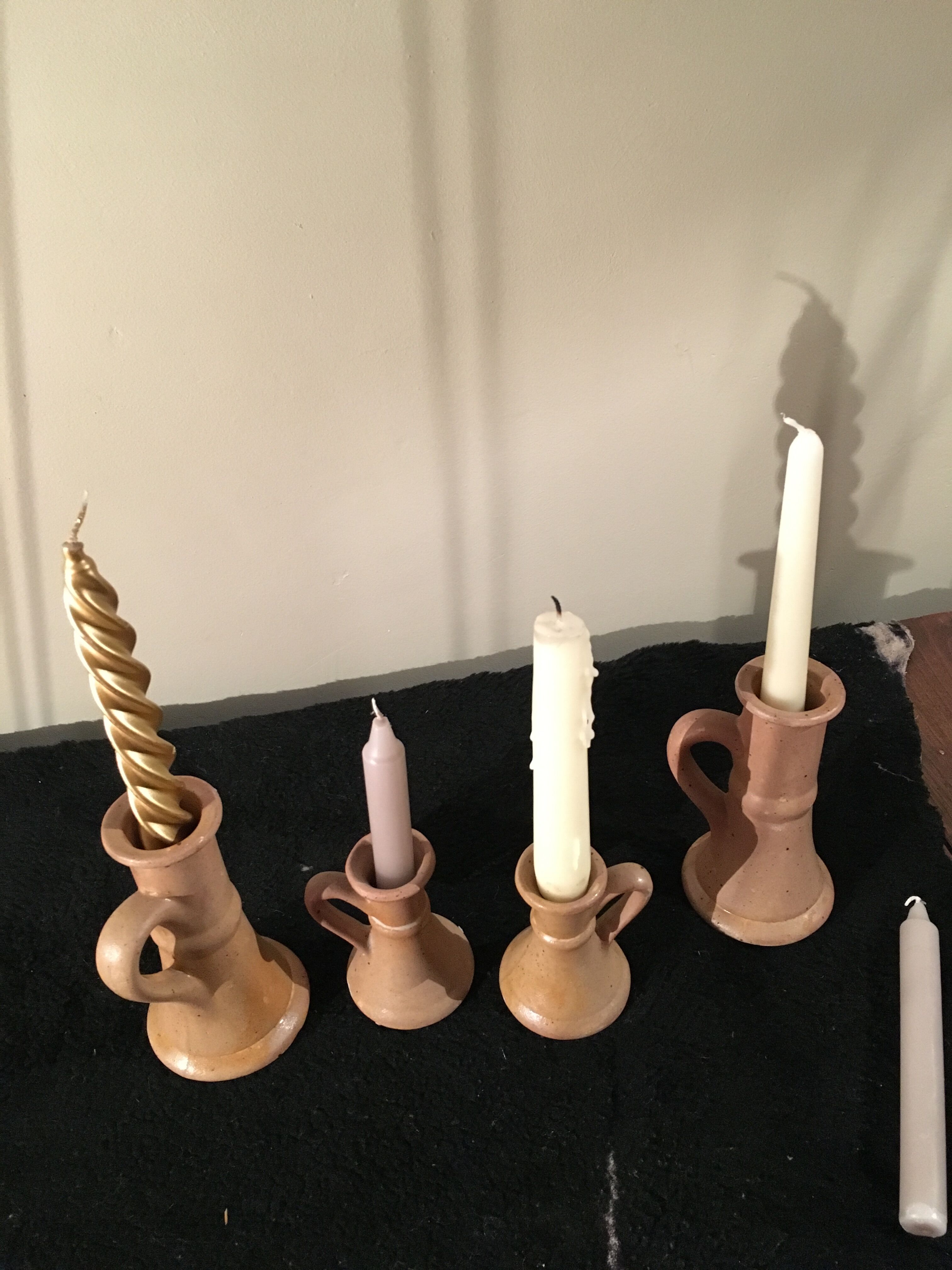 Set of 4 candlesticks in sandstone