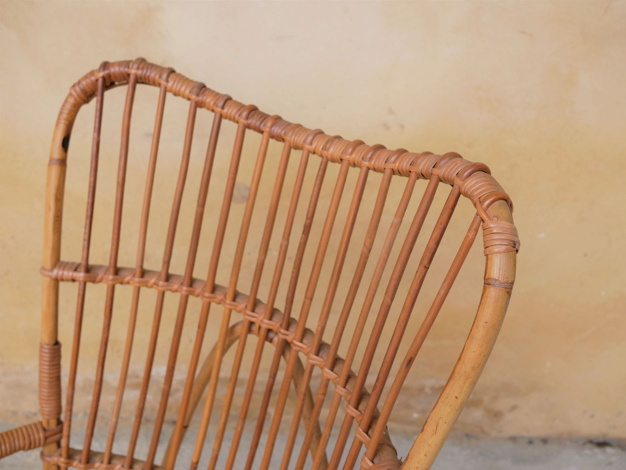 Vintage rattan chair by Louis Sognot